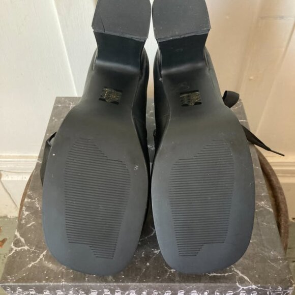 This is a pair of black platform high heels. - Picture 5 of 6